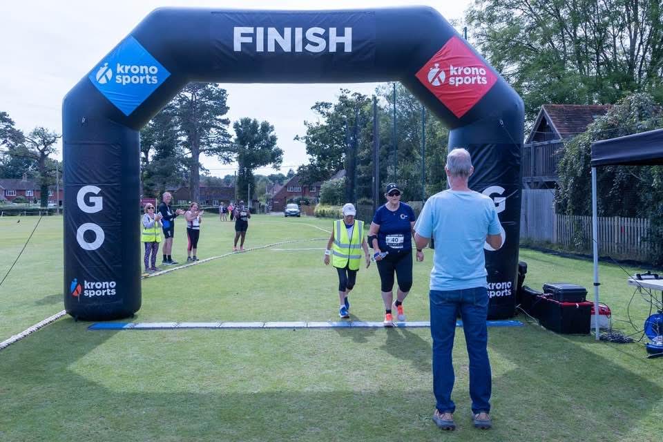 Lorraine Hunter crossing the finish line