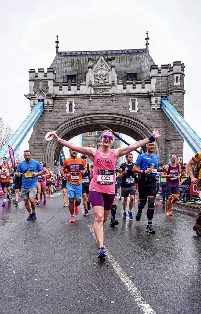 Emma and other runners crossing Tower Bridge in the London Marathon
